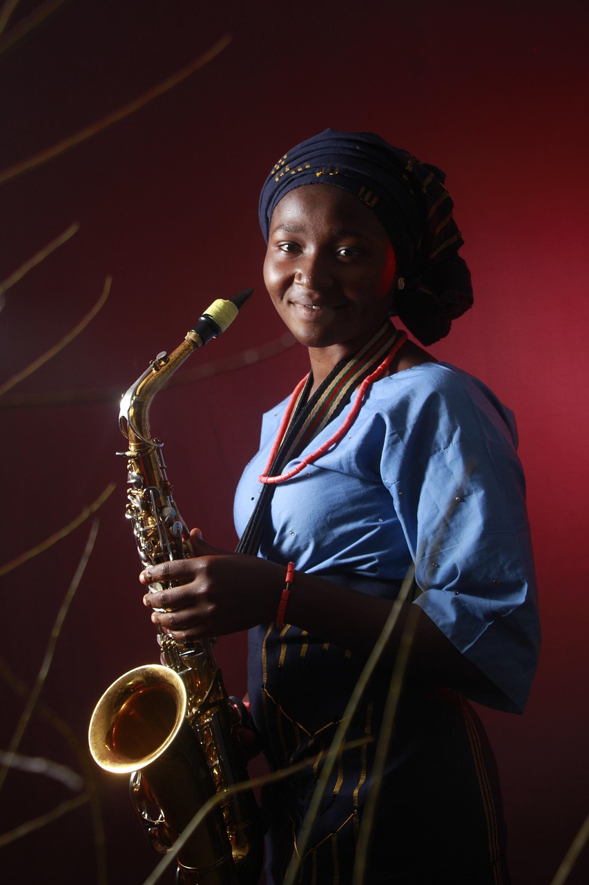 African female saxophonist performing on stage